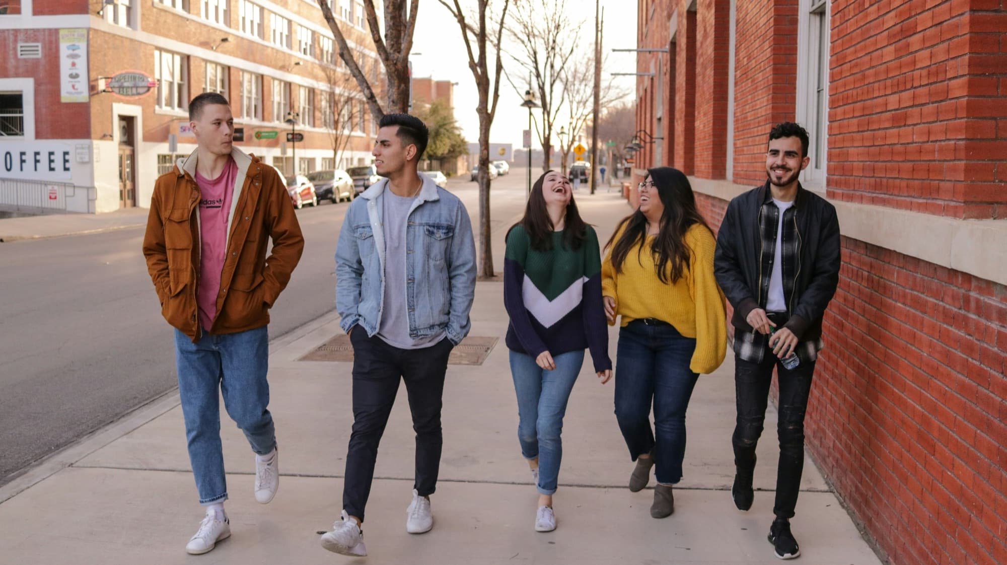 A group of teens laughing together